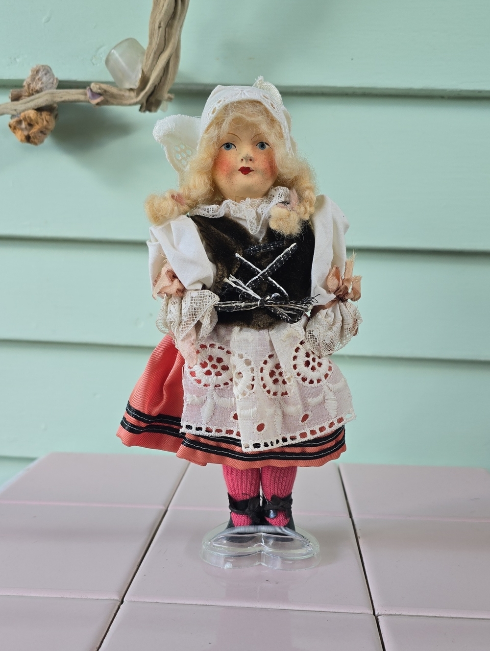Vintage composition or celluloid doll in traditional European folk costume